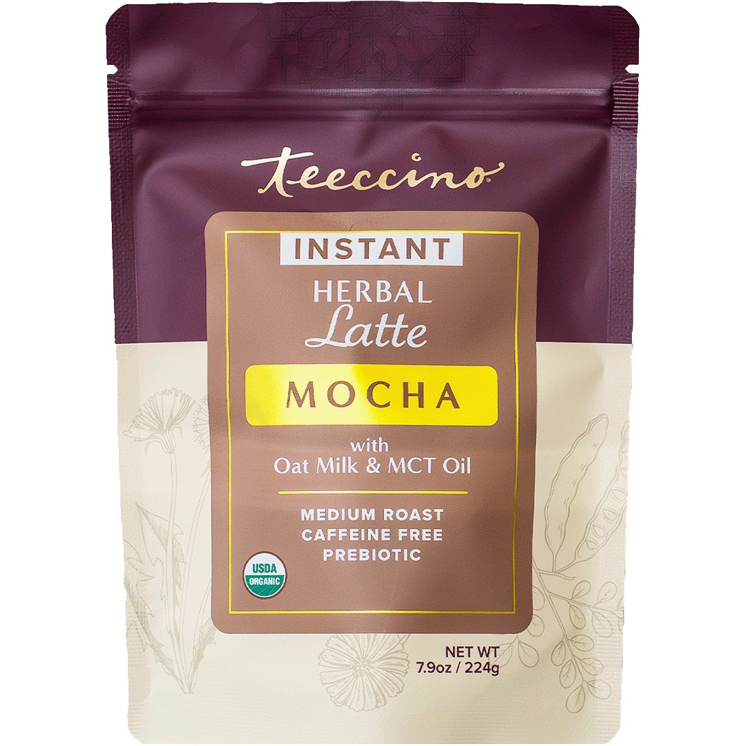 Teeccino instant mocha herbal latte in a cup, showcasing rich mocha flavor with herbal ingredients, front view on a white background.