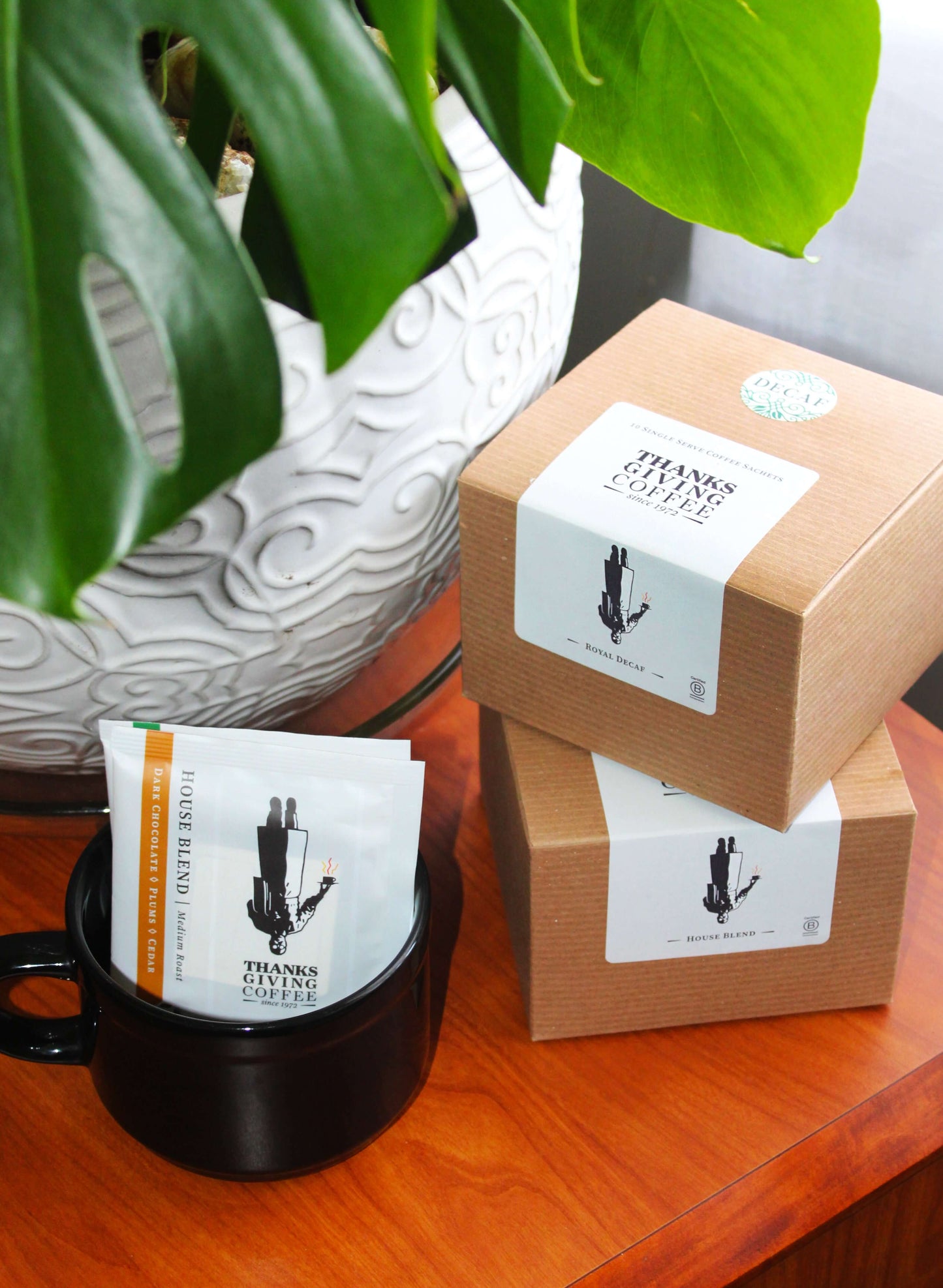Royal Decaf Pour Ta pour-over coffee packet by Thanksgiving Coffee Company, showcasing medium roast coffee grounds in a sealed packet.