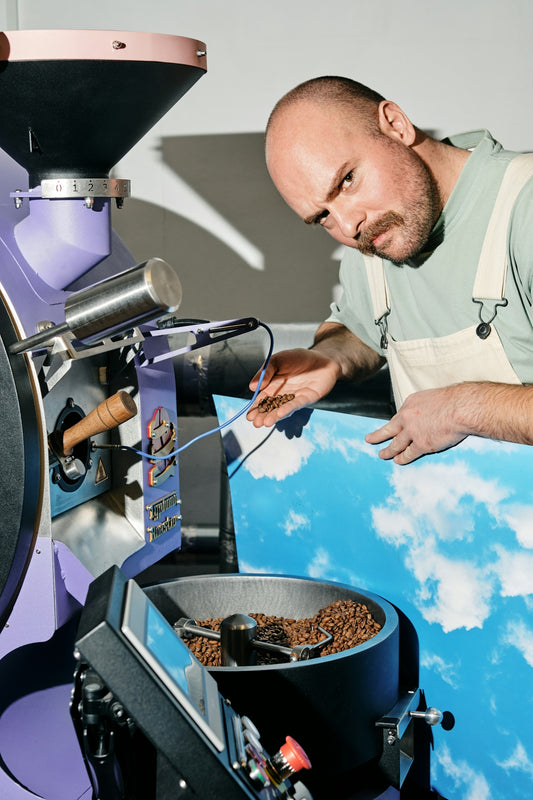 A man is making something out of a machine