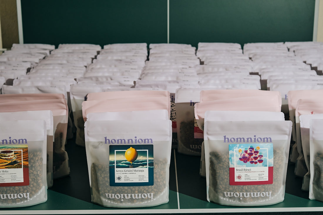 A bunch of bags of coffee sitting on a shelf