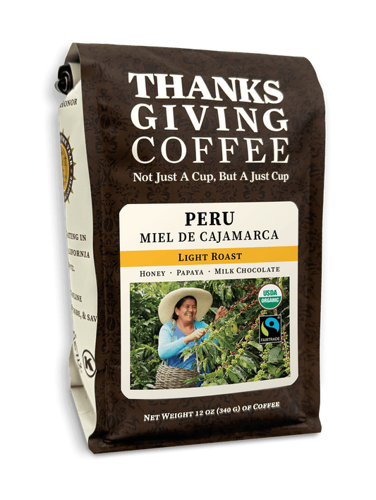 Light roast Peru Miel de Cajamarca coffee pack from Thanksgiving Coffee Company, showcasing fresh roasted beans in the bag.