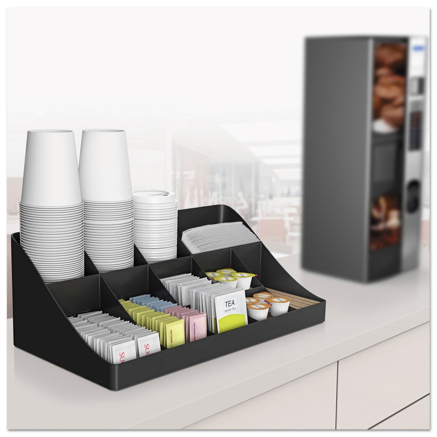 Black Mind Reader 11-compartment coffee condiment station with utensils and condiments, measuring 18.25 x 6.63 x 9.78 inches.