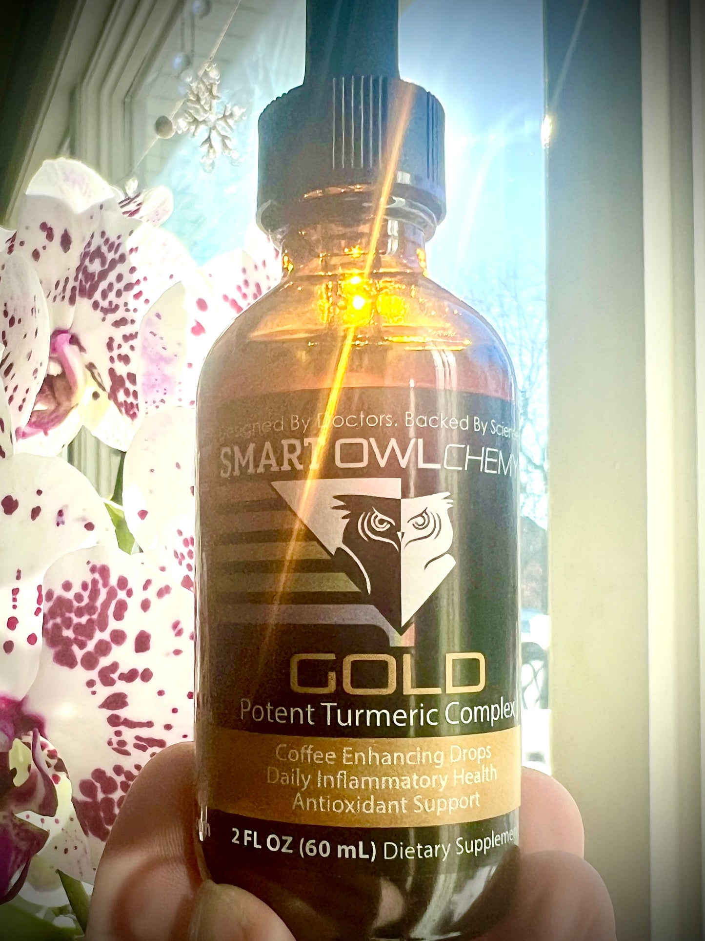 Smart Owl Coffee Gold Drops Turmeric Extract supplement drop in a small bottle with a dropper for easy use.