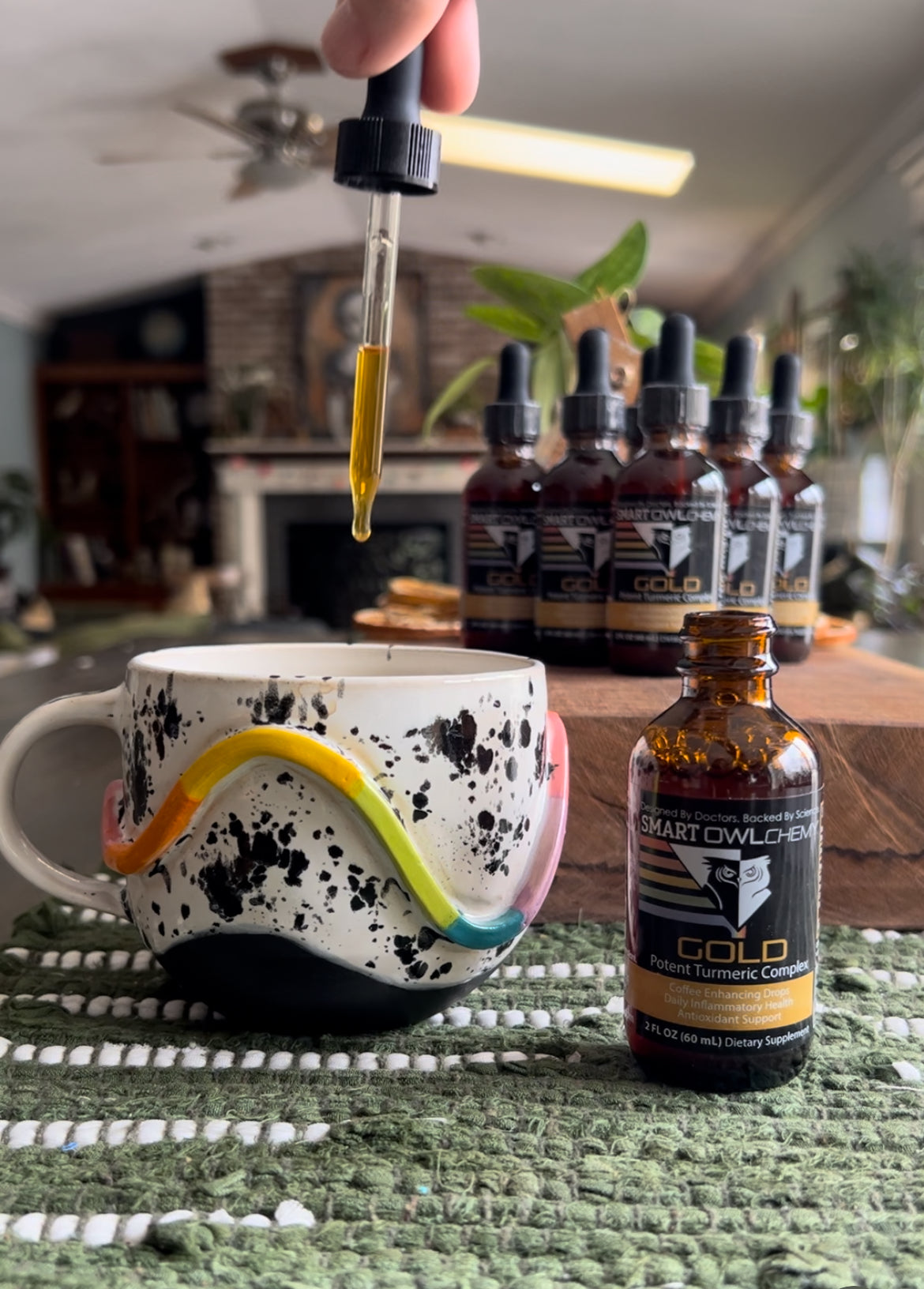 Smart Owl Coffee GOLD DROPS Smart OWLchemy turmeric extract supplement drop in 2oz bottle, golden liquid with dropper cap.