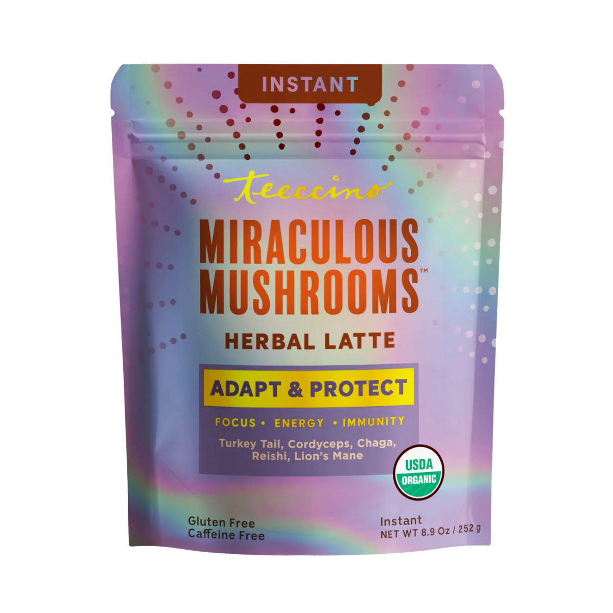 Teeccino Miraculous Mushrooms® Adapt & Protect Instant Herbal Latte in a cup with frothy top and herbal ingredients visible