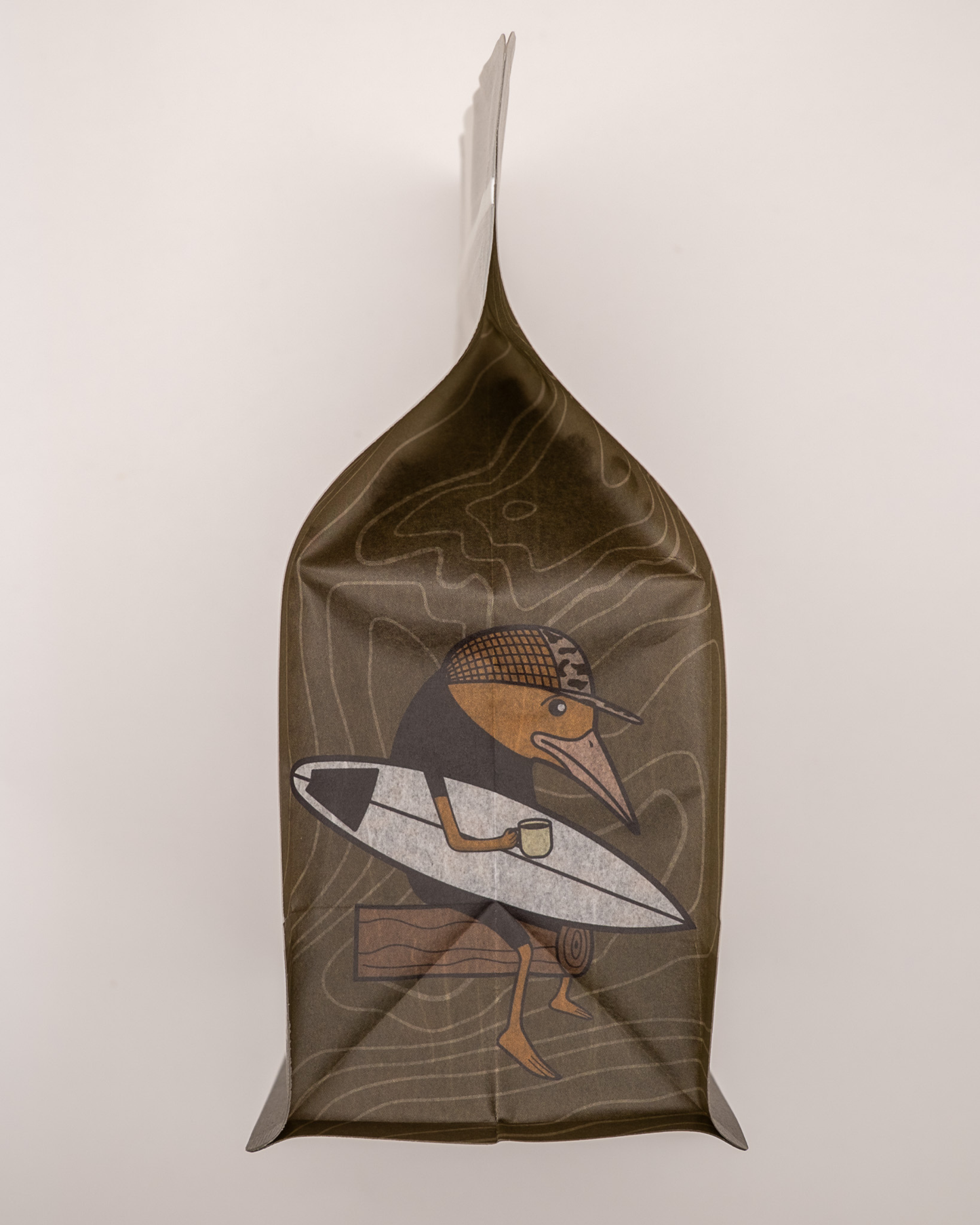 Sad Bird Coffee FIRST LIGHT Half Caff Medium Roast coffee bag with label and branding visible.