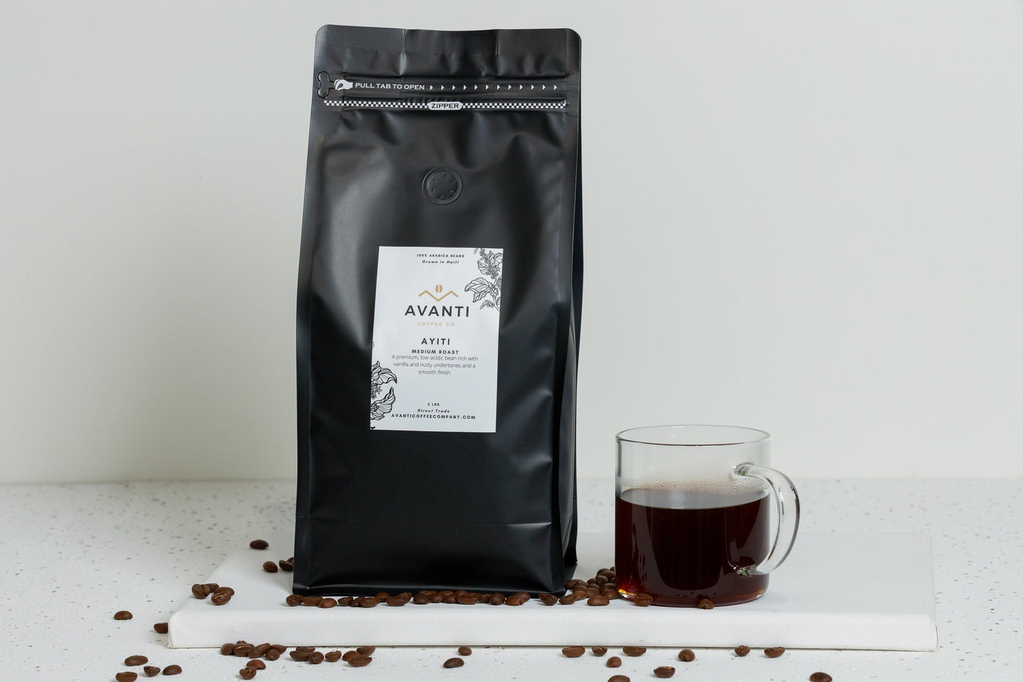 Medium roast coffee bag from Avanti Coffee Company labeled Ayiti-Medium Roast, with a brown and beige packaging design.