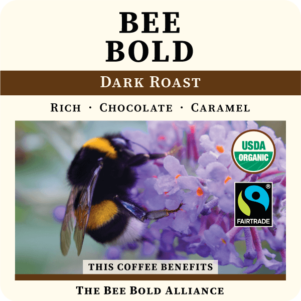 Freshly brewed Bee Bold Dark Roast coffee from Thanksgiving Coffee Company in a steaming cup with rich, dark color and aromatic crema.