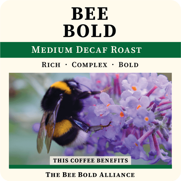 Decaf medium roast coffee bag from Thanksgiving Coffee Company with a bee bold design and natural coffee bean imagery.
