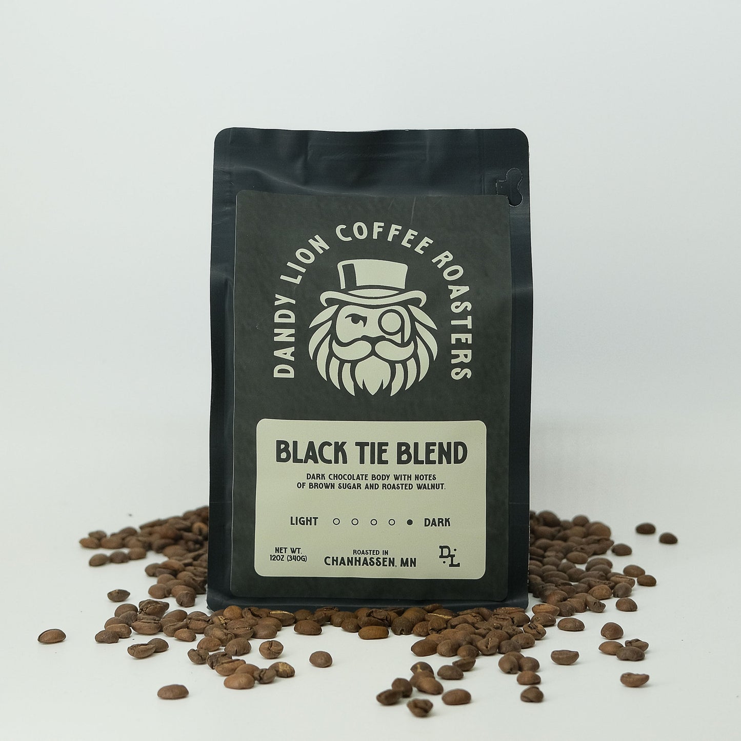 Dandy Lion Coffee Black Tie Blend in a bag, showcasing rich dark roasted coffee beans and packaging design.