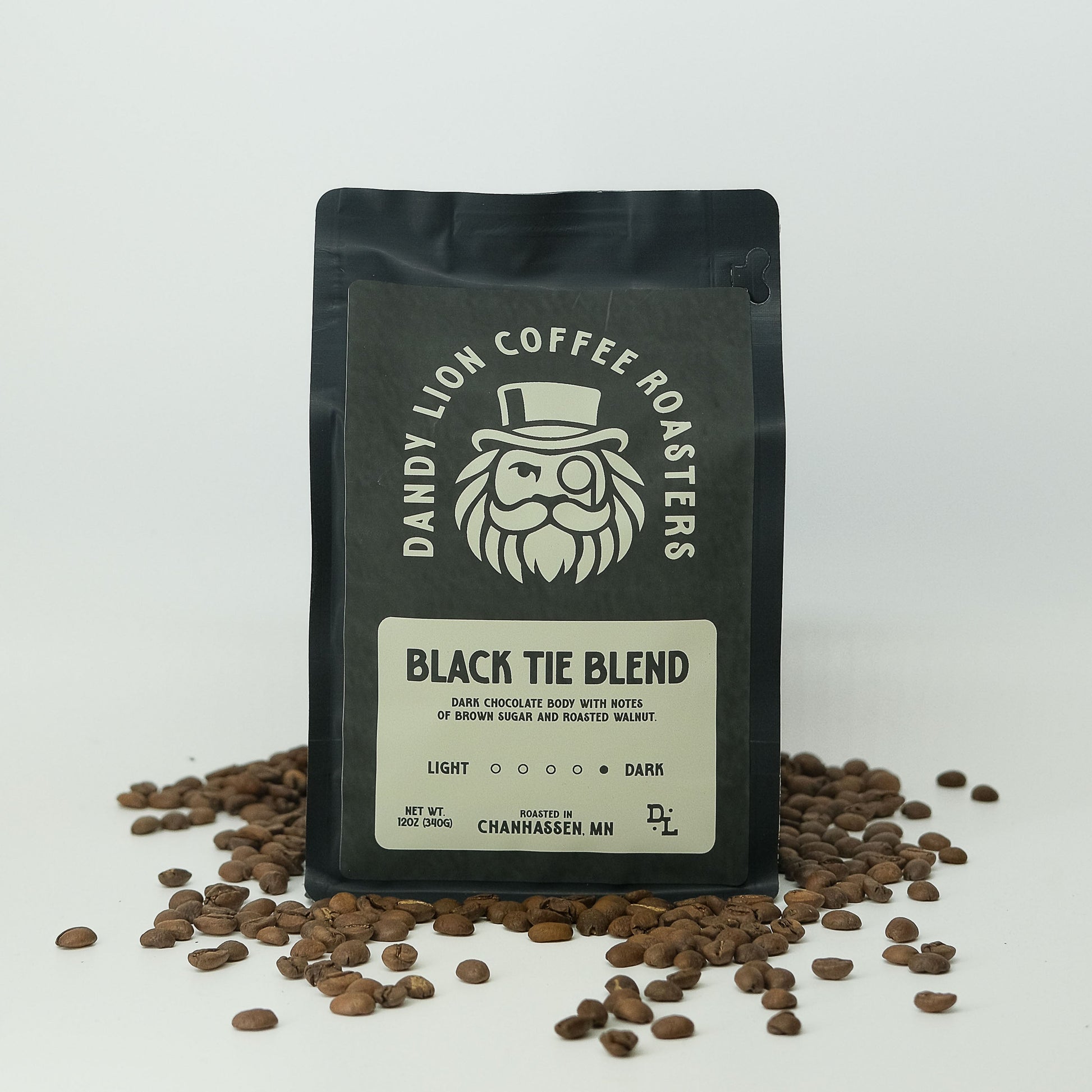 Dandy Lion Coffee Black Tie Blend in a bag, showcasing rich dark roasted coffee beans and packaging design.