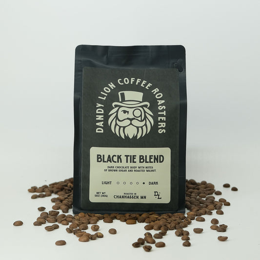 Dandy Lion Coffee Black Tie Blend in a bag, showcasing rich dark roasted coffee beans and packaging design.