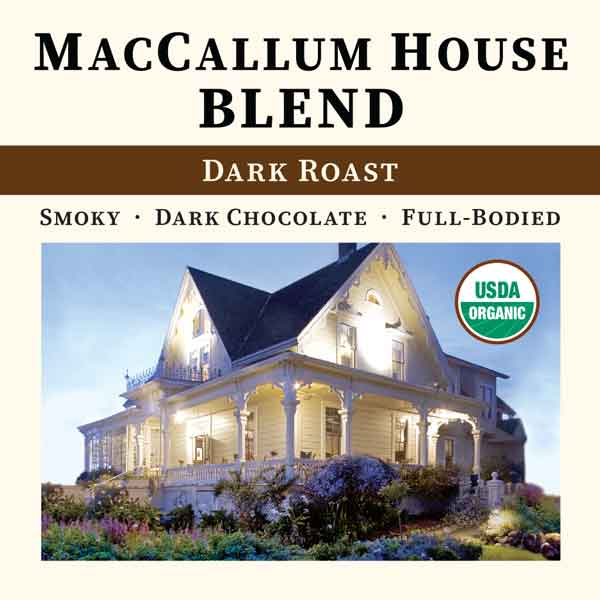 Cream-colored bag of Thanksgiving Coffee Company's MacCallum House Blend Dark Roast coffee with the front label visible.