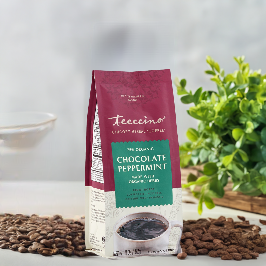 Chocolate peppermint chicory herbal coffee by Teeccino in a cup with swirling chocolate and peppermint leaves on a rustic background.