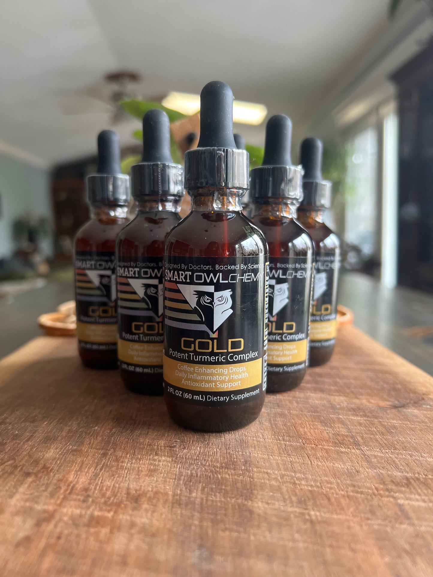 Smart Owl Coffee GOLD DROPS Smart OWLchemy turmeric supplement drop in a small 2oz bottle with a dropper for easy use