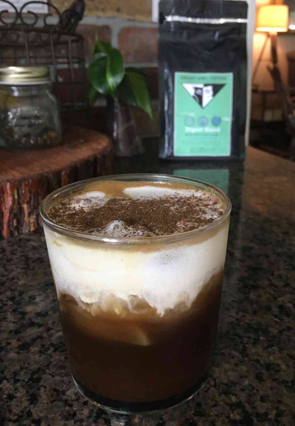 Swiss Decaf Digest Blend coffee by Smart Owl Coffee showing a steaming cup of herbal-infused decaffeinated coffee for digestion.
