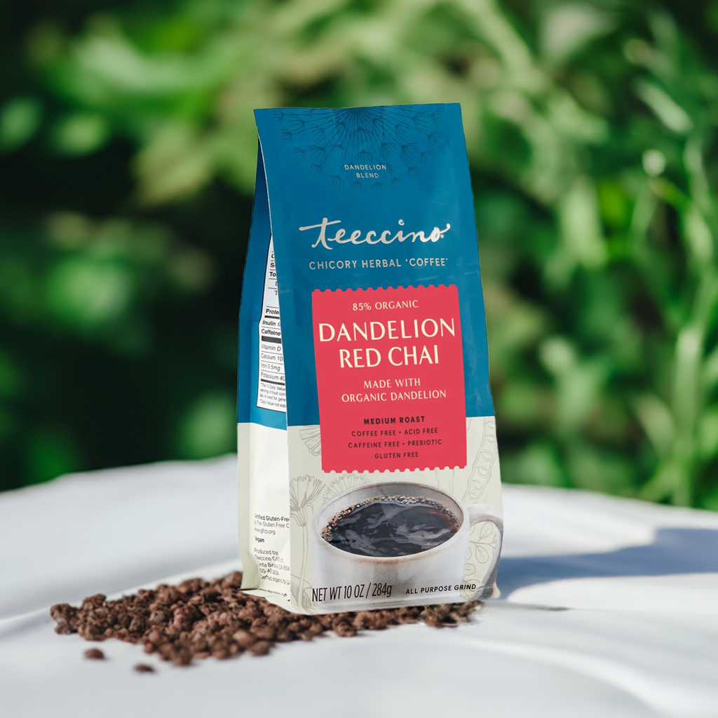 Dandelion Red Chai herbal coffee by Teeccino in a mug with a warm chai spice blend and dried dandelion root pieces.