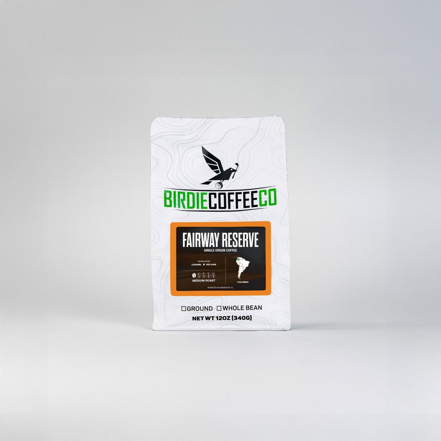 Fairway Reserve Colombia Coffee from Birdie Coffee Company, featuring rich, roasted beans in a natural setting.