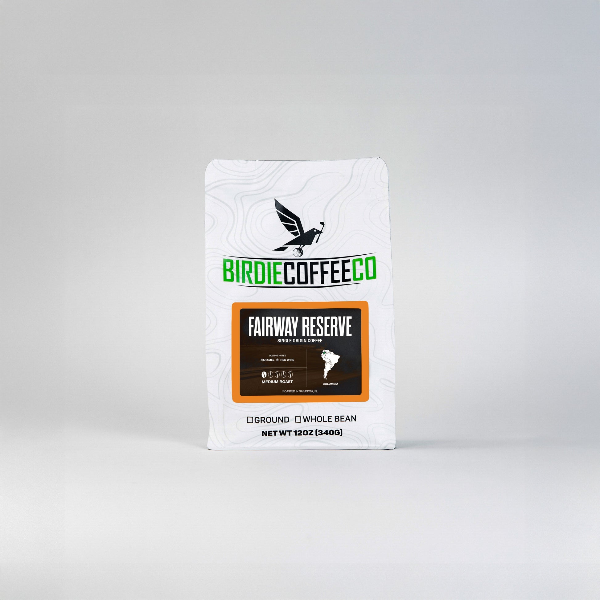 Fairway Reserve Colombia Coffee from Birdie Coffee Company, featuring rich, roasted beans in a natural setting.