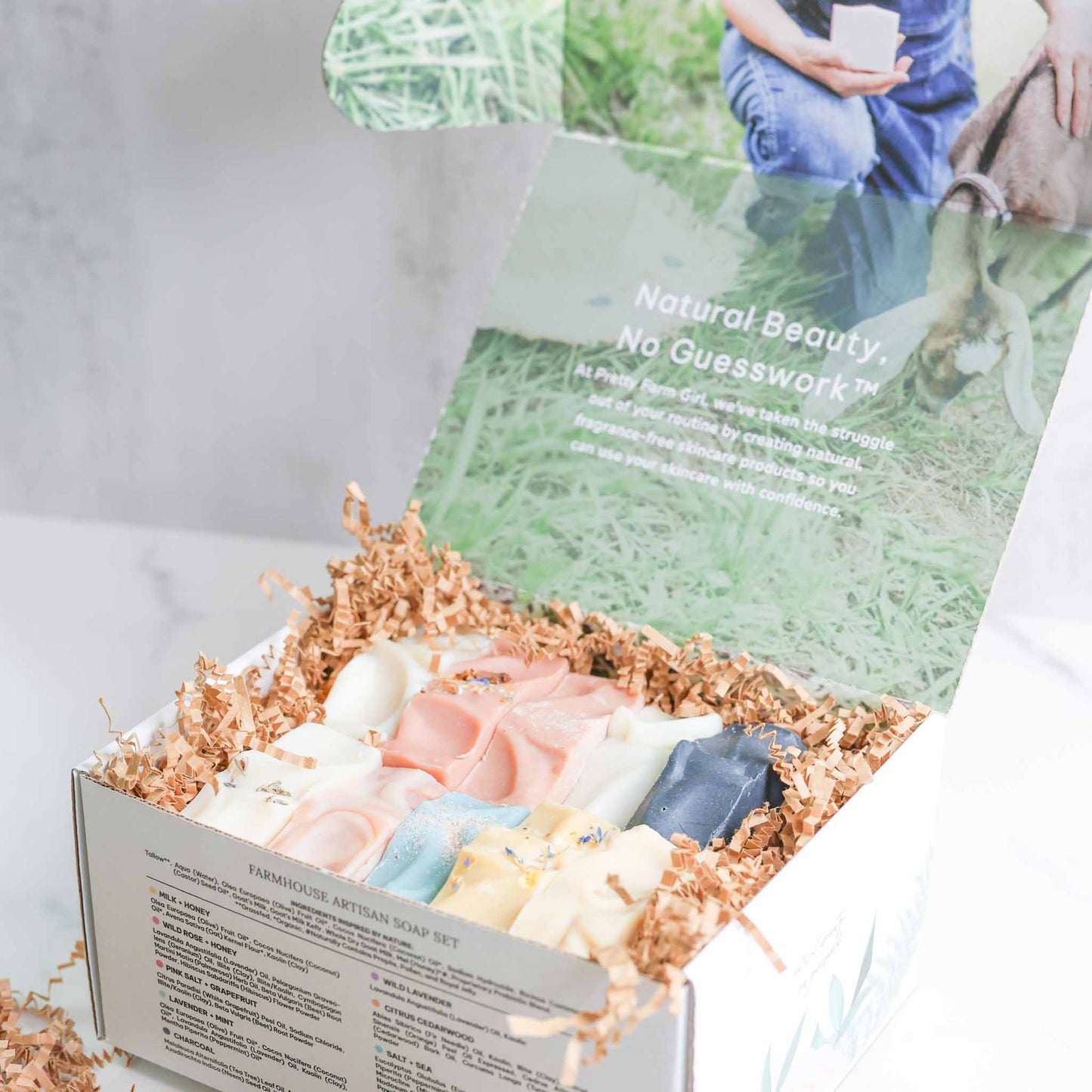 Farmhouse artisan goat milk and tallow soap collection by Pretty Farm Girl, displayed in a decorative box.