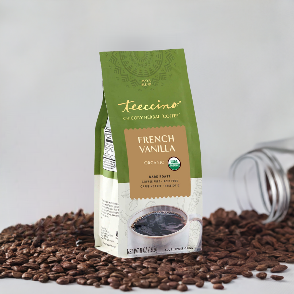 French vanilla chicory herbal coffee by Teeccino in a mug with vanilla beans and chicory root, showcasing a warm, inviting beverage.