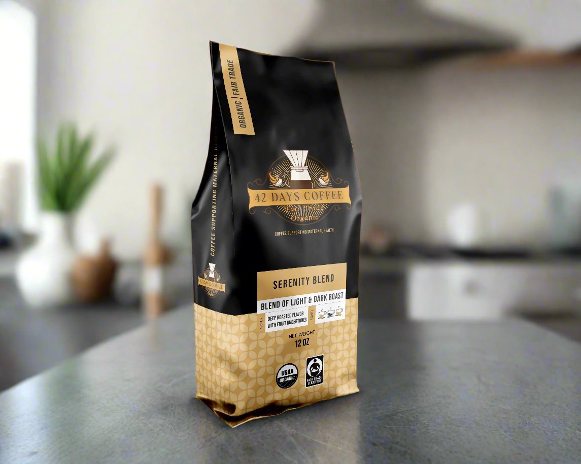 Front view of 42 Days Coffee Serenity Blend organic light and dark roast coffee bag with label and branding.