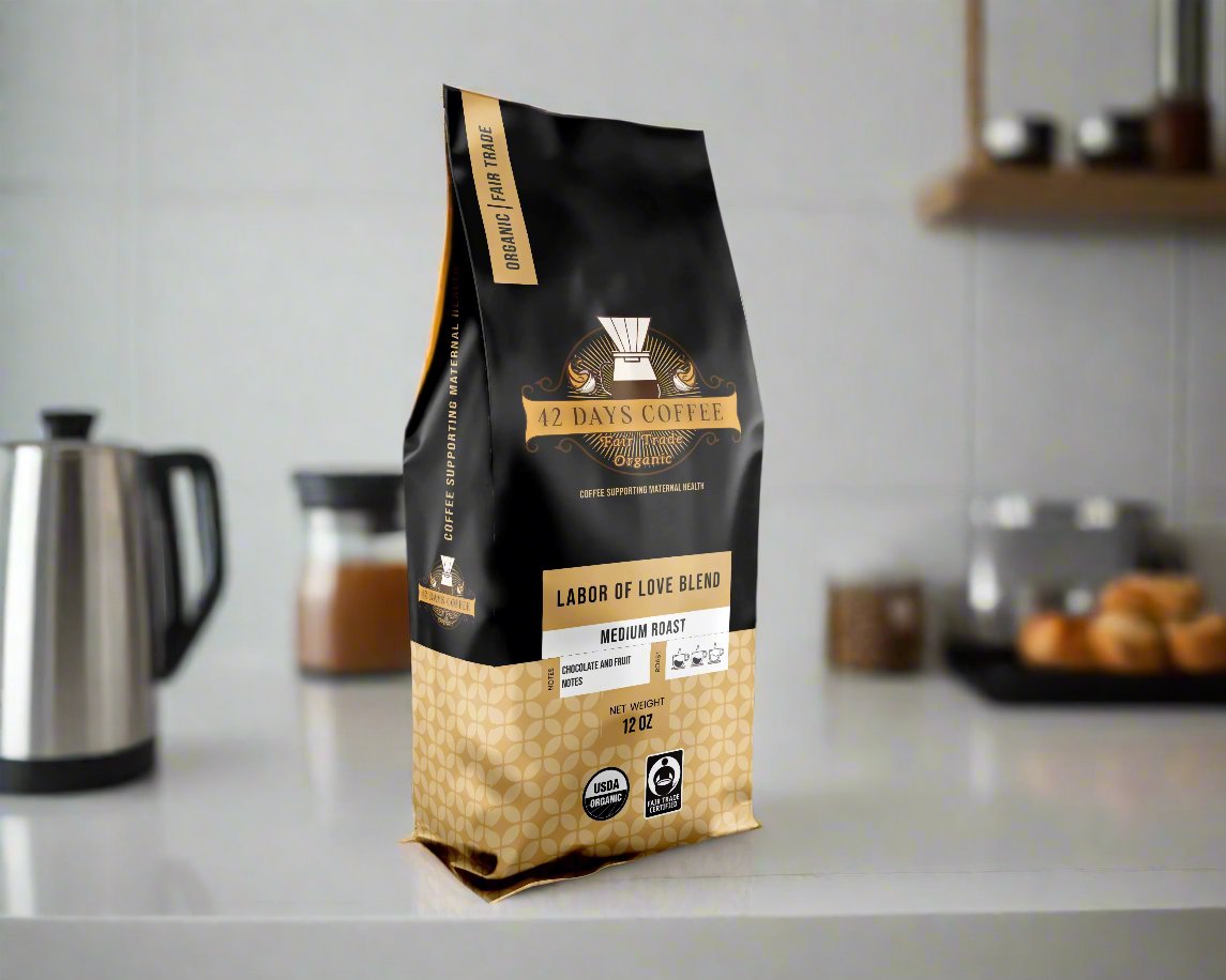Front view of 42 Days Coffee Labor of Love Blend organic light roast coffee bag with label and branding.