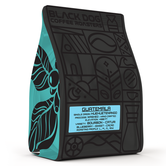 Black Dog Coffee Roasters Guatemala coffee bean bag with colorful Guatemala.png label, showcasing rich, roasted coffee beans.