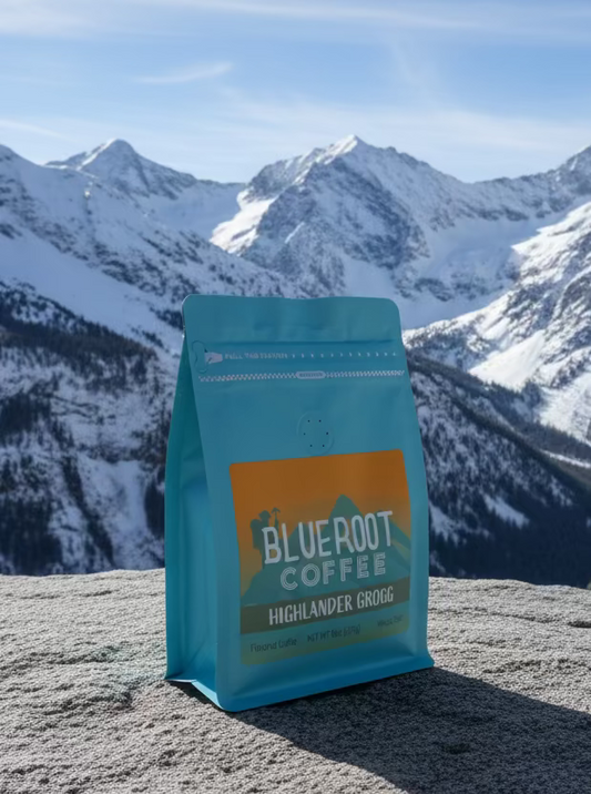 Highlander Grogg flavored coffee by Blueroot Coffee, steaming mug with rich dark brew and a cozy, inviting presentation.