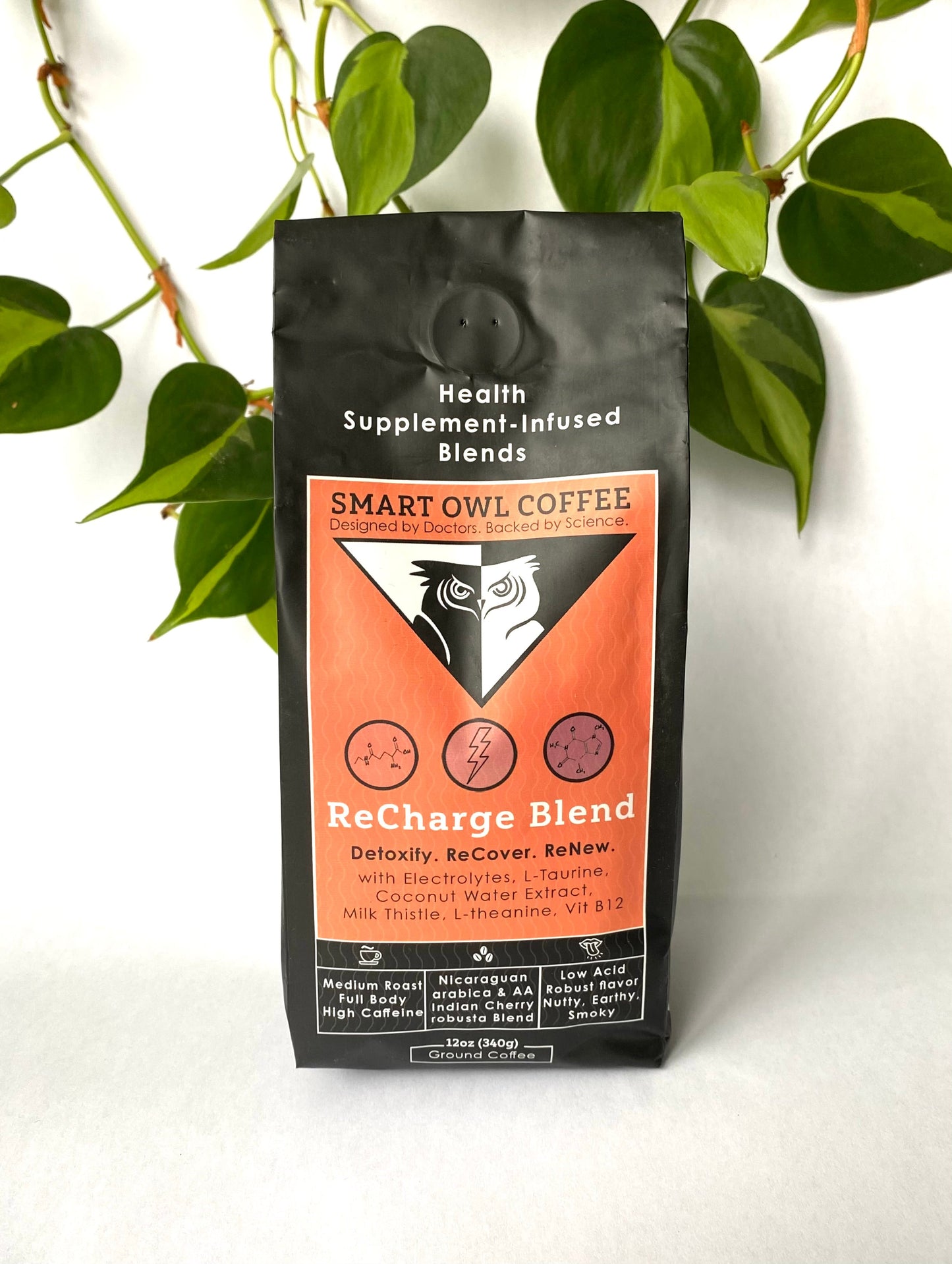 Smart Owl Coffee Recharge Blend detox coffee in a mug, featuring a rich, aromatic brew with fresh coffee beans in the background.