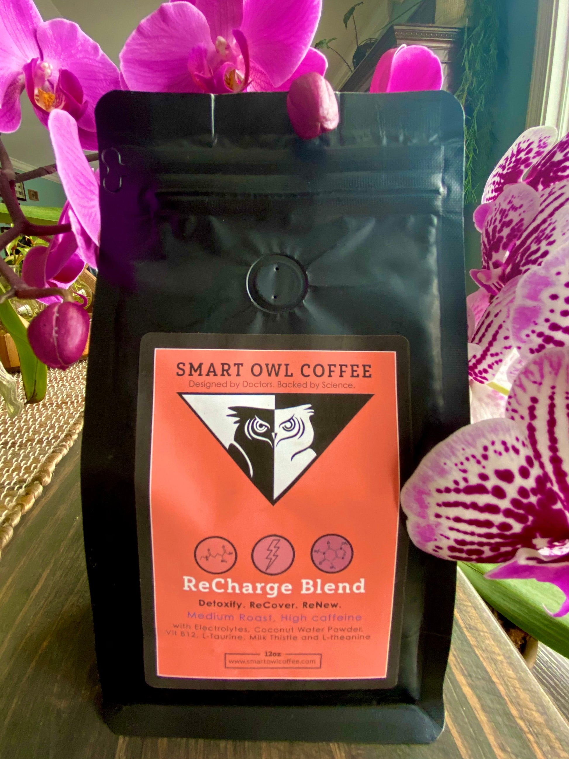 Smart Owl Coffee Recharge Blend detox coffee in a mug, showcasing a steaming cup with coffee beans and natural ingredients.