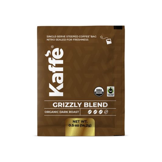 Kaffe Products Grizzly Blend dark roast steeped coffee bag, 5-pack, with rich coffee grounds inside a sealed steeping bag.
