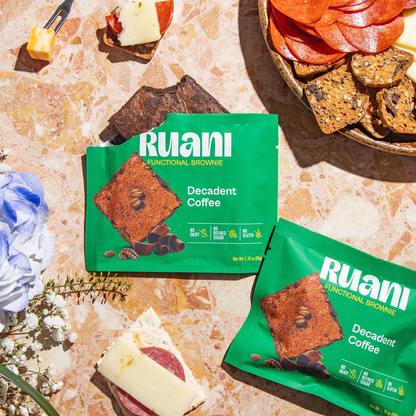 Six delicious coffee-flavored brownies from eatruani, showcasing rich chocolate and coffee swirls on a white plate.