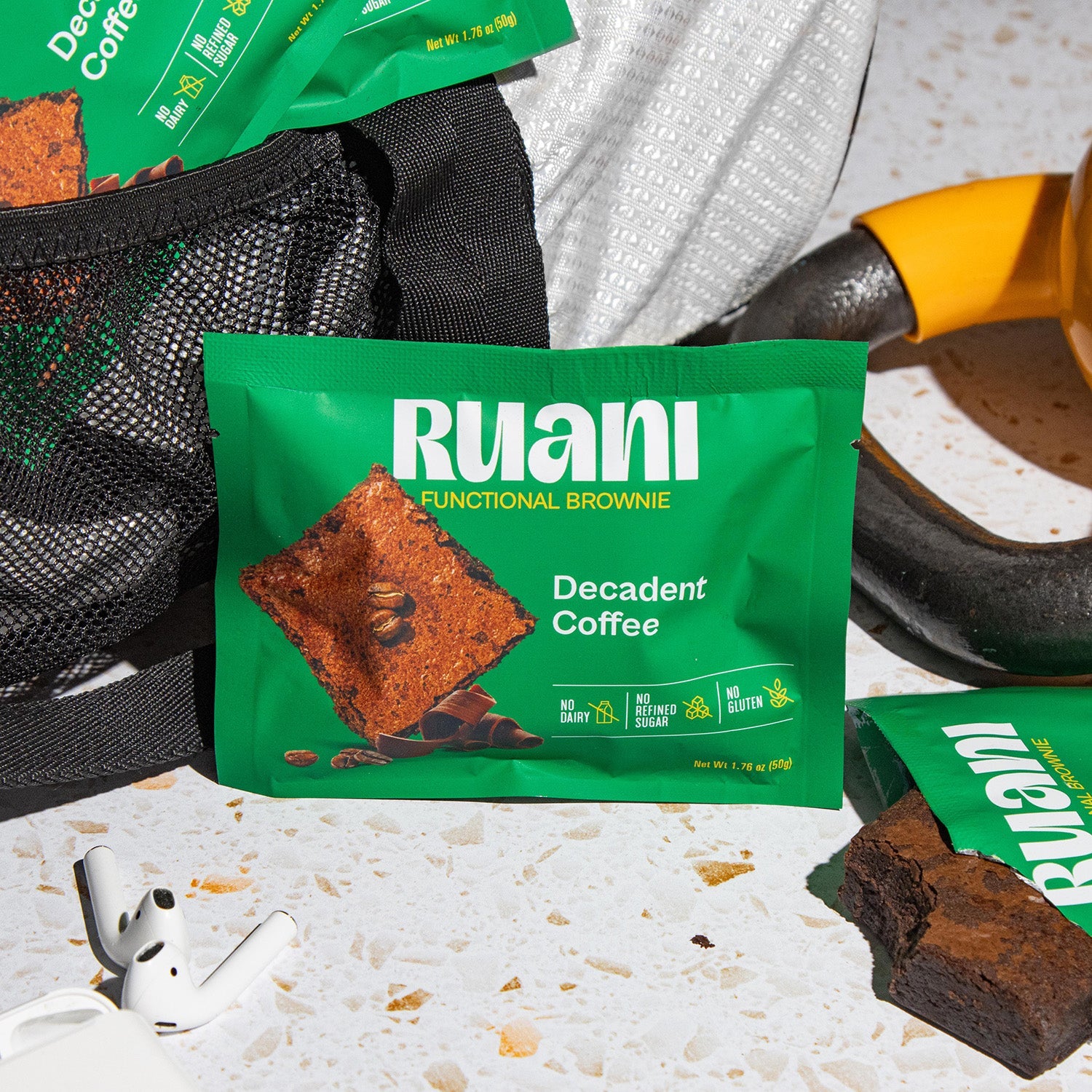 Six decadent coffee-flavored brownies from eatruani arranged on a plate, showcasing rich chocolate and coffee swirls.