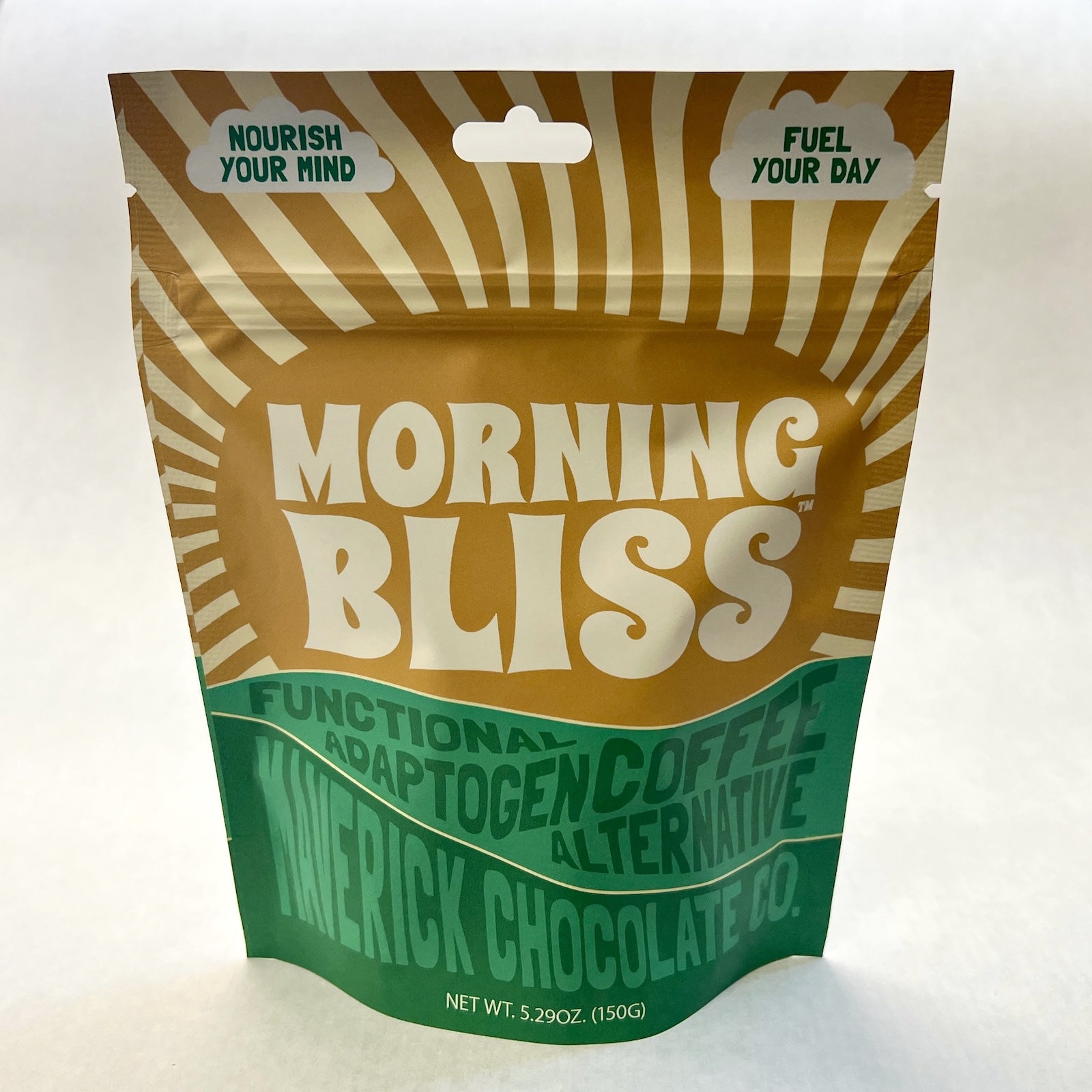 Morning Bliss functional adaptogen coffee alternative drink in a glass with a leafy background by MaverickChocolate.