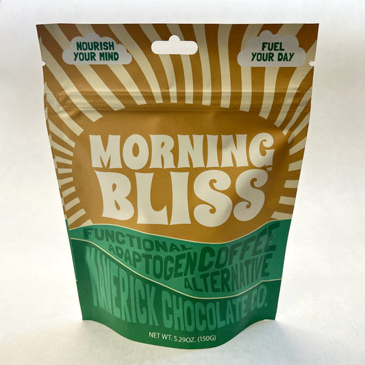 Morning Bliss functional adaptogen coffee alternative drink in a glass with a leafy background by MaverickChocolate.