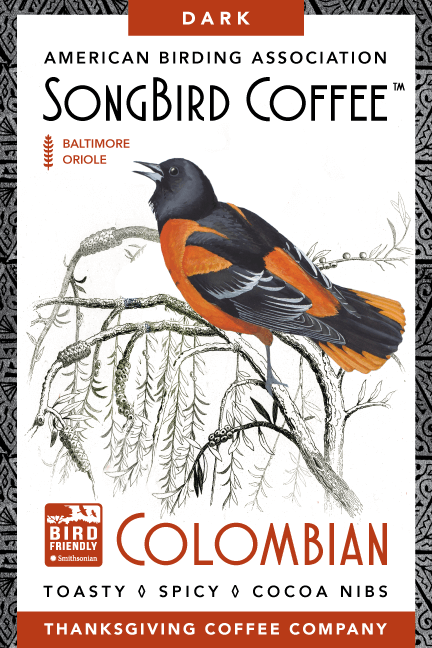 Dark roast SongBird Colombian coffee beans from Thanksgiving Coffee Company, shown in a front view image.