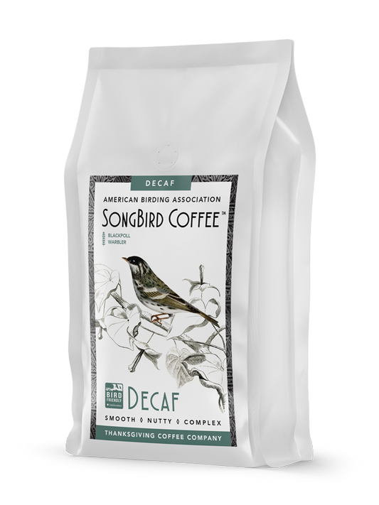 Decaf medium roast coffee bag from SongBird Decaf by Thanksgiving Coffee Company, featuring a balanced, rich coffee blend.