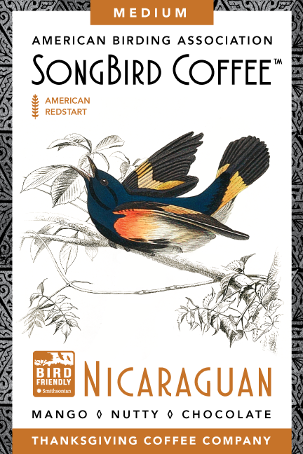 Medium roast SongBird Nicaraguan coffee bag from Thanksgiving Coffee Company with vibrant label design.