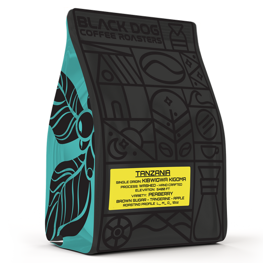 Tanzania Peaberry coffee beans from Black Dog Coffee Roasters displayed in a bag with a Tanzania map background.