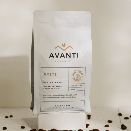 Medium roast coffee bag from Avanti Coffee Company featuring Ayiti blend in a natural, close-up shot of the packaging.