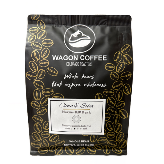 Wagon Coffee Clean & Sober Ethiopian roast coffee bag with vibrant label design and fresh coffee beans shown.