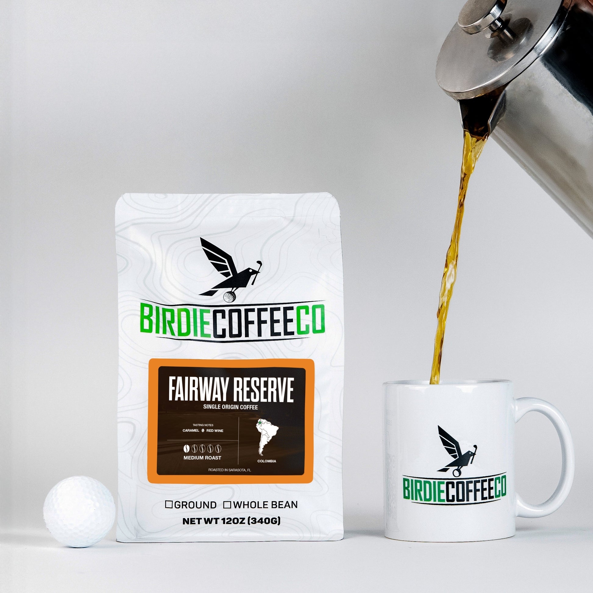 Freshly brewed Fairway Reserve Colombia Coffee from Birdie Coffee Company in a white ceramic cup with a rich crema on top.