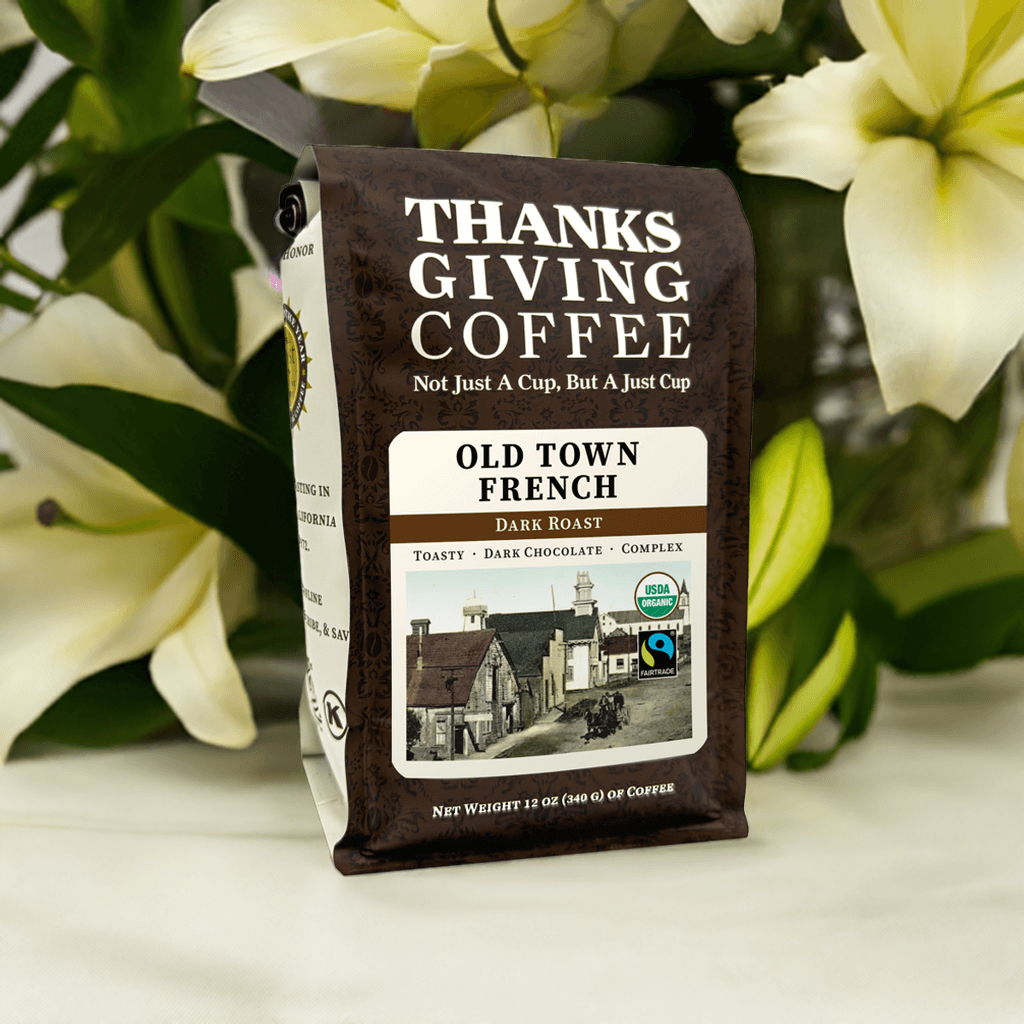 Dark roasted Old Town French FTO coffee beans from Thanksgiving Coffee Company, shown in a close-up image.