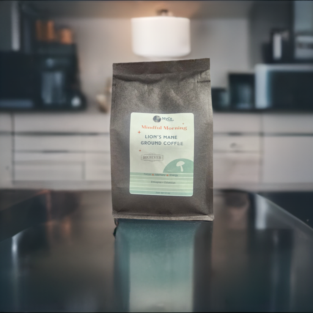Ground Lion's Mane coffee from MyCo Planet showing a bag of Lion's Mane Ground Coffee with coffee beans next to it.