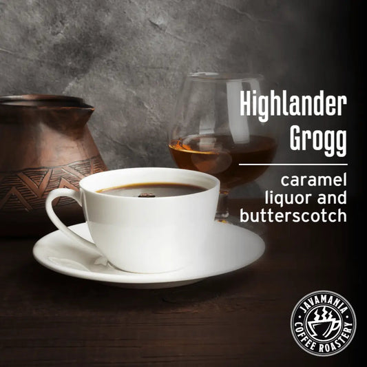 JavaMania Highlander Grogg flavored coffee in a mug with rich, aromatic coffee beans and a cozy setting.
