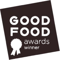 Icon award badge for Thanksgiving Coffee Company's The Upsetter FTO Light Roast coffee, celebrating quality and excellence.
