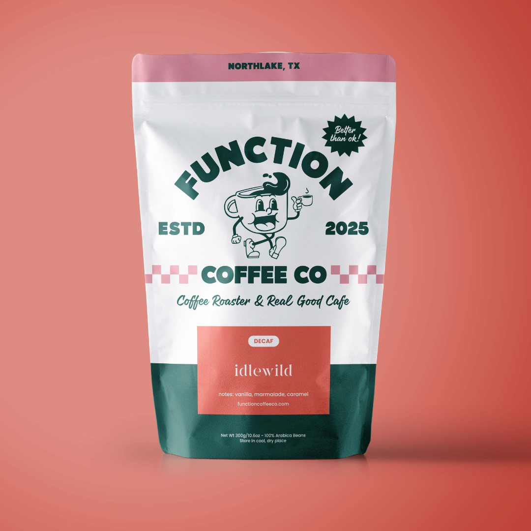 Decaf medium roast coffee beans by Function Coffee Co, showing a bag of Idlewild decaffeinated coffee for brewing or grinding.