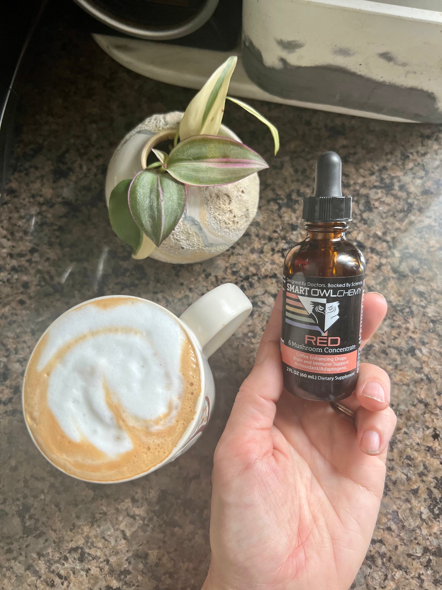 Smart Owl Coffee RED DROPS Smart OWLchemy mushroom extract supplement drop in a small 2oz bottle, used for health and wellness.