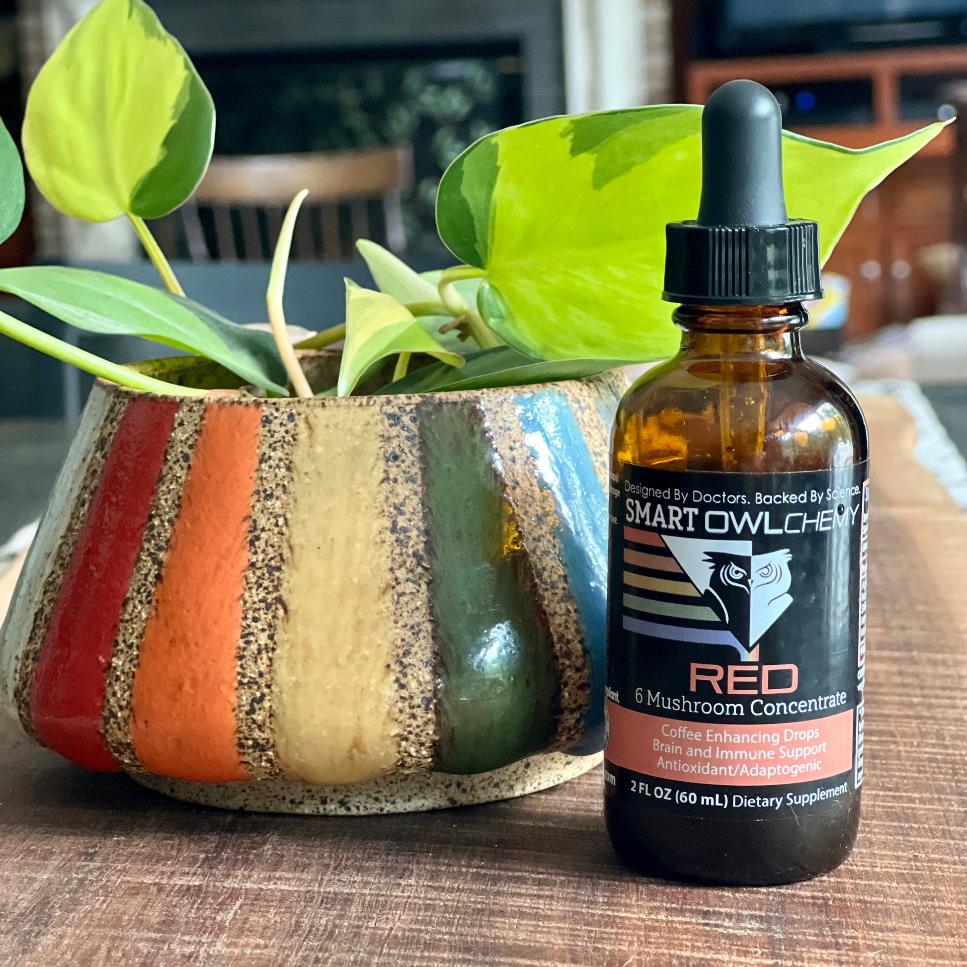 Smart Owl Coffee RED DROPS Smart OWLchemy mushroom extract supplement drop in a small 2oz bottle.